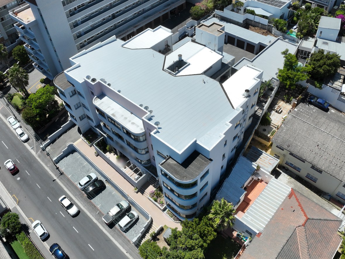 Aerial view of a residential apartment building, intact, shown from the baseline survey